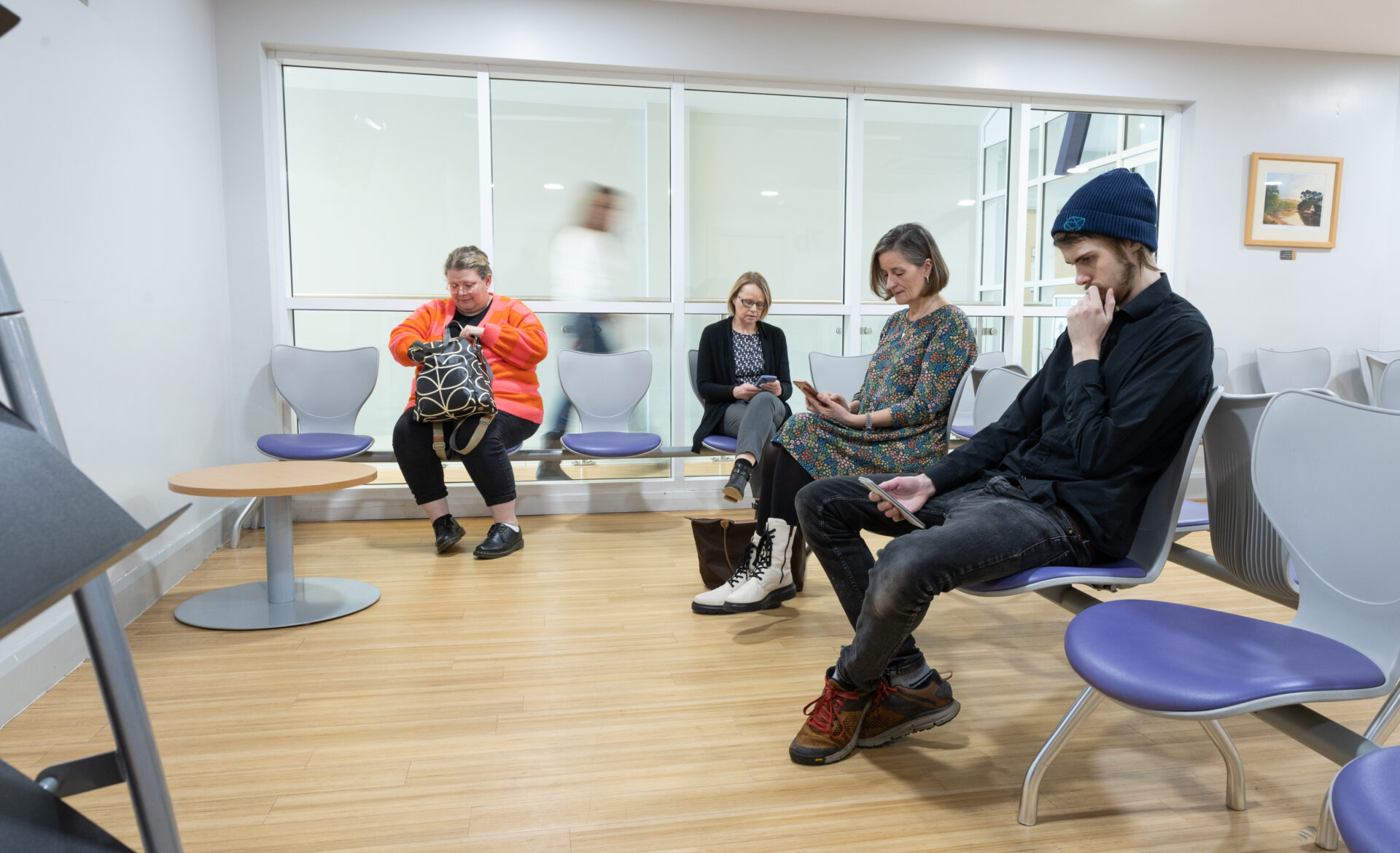 Picture of 4 people sat in a waiting room