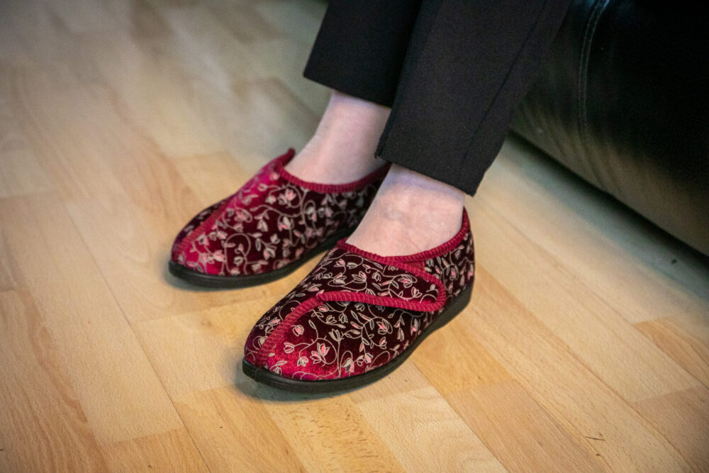Pair of women's slippers on feet