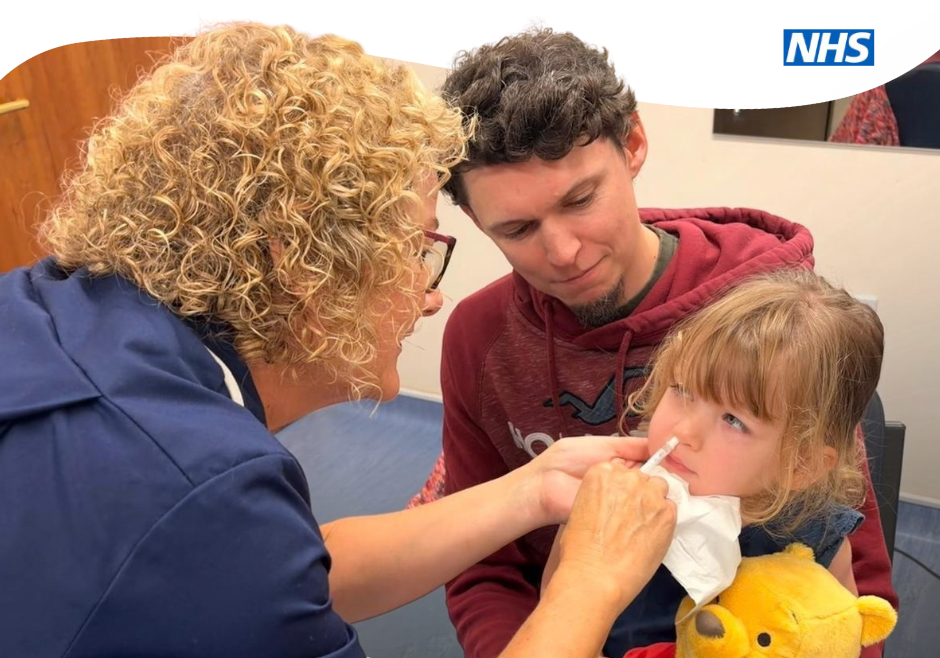 Girl having flu vaccine