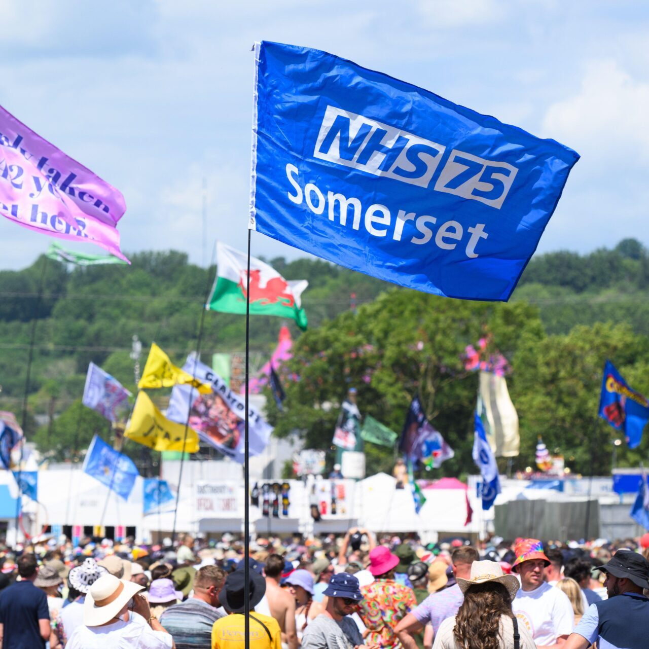 2R957Y5 Somerset, UK. 24 June 2023. A flag supporting the NHS at the Glastonbury Festival at Worthy Farm in Somerset. Picture date: Saturday June 24, 2023. Photo credit should read: Matt Crossick/Empics/Alamy Live News